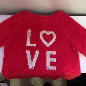Cute red love sweater.